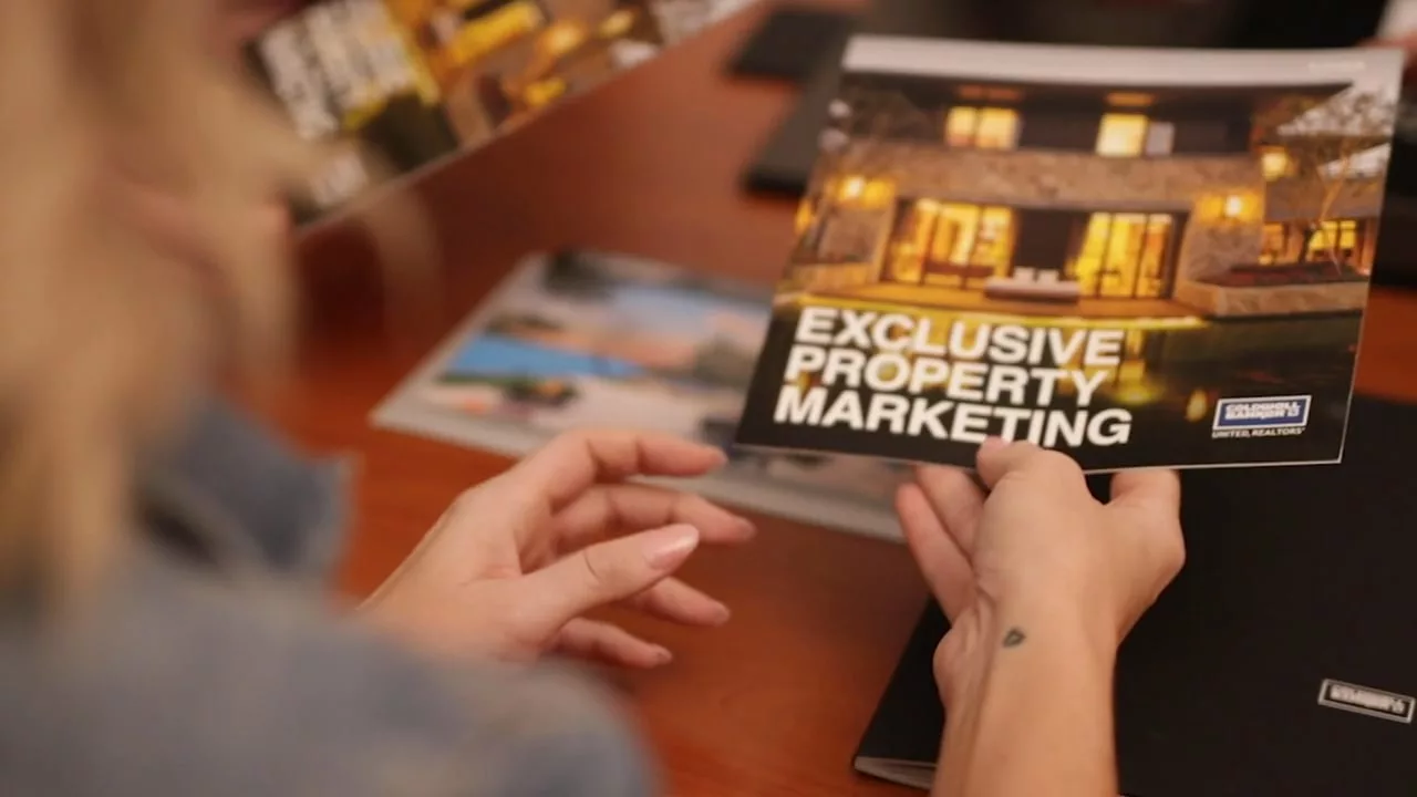 woman holding a brochure